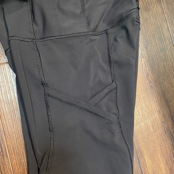 Lululemon black capris w/ pockets and mesh. Size 4 - Picture 4 of 4